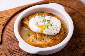 Thyme soup with poached egg. Traditional Spanish tapa recipe.