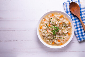 Soupy rice with cod, carrot and artichokes. Traditional Spanish tapa.