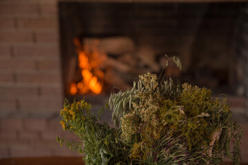 Fireplace in house with dry flowers on front