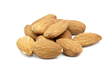 Almond nuts isolated on white background. Heap of peeled almonds