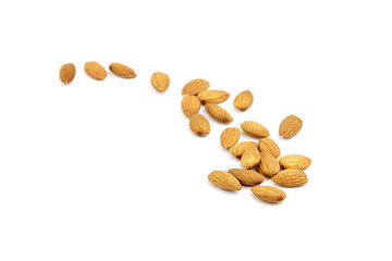 Almond nuts isolated on white background. Heap of scattered almonds