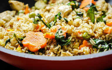 Thai style fried rice with green curry paste and chicken close up look on the pan, Famous Thai fried rice