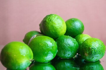 limes on a wooden background