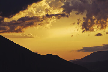 Cloudy sunset over the mountains