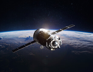 Spaceship on orbit of the Earth planet. Dark space. Elements of this image furnished by NASA