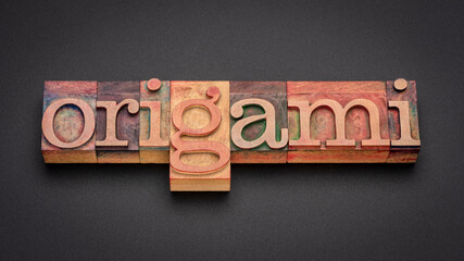 origami word abstract in vintage letterpress wood type, art of paper folding associated with Japanese culture