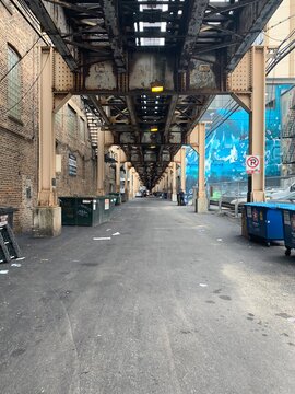 Chicago Alley under Elevated Train Industrial Perspective Vanishing Point
