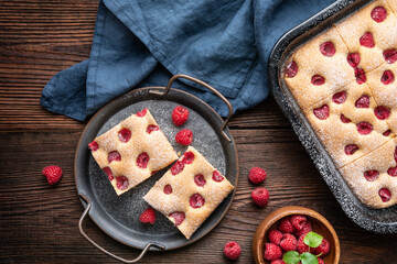 Raspberry cake known as Bublanina sprinkled with powdered sugar