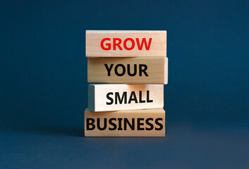 Grow your small business symbol. Concept words 'Grow your small business' on wooden blocks on a...