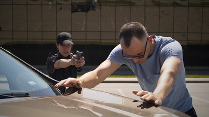Female police officer arresting male driver