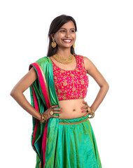 Beautiful Indian traditional girl posing on white background.
