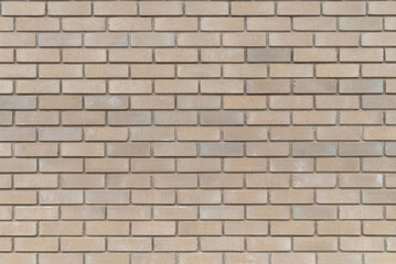 Fototapeta premium The texture of the decorative sand-colored brickwork, background.