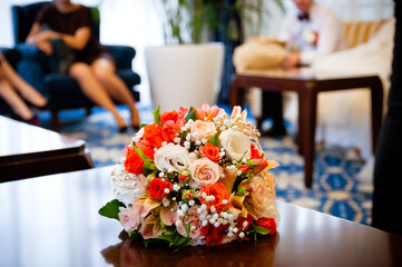 Gentle Bouquet of Flowers Lies on a Table Wedding Bouquet of Orange and Pink Flowers Lies on Table Close-up Copy Space