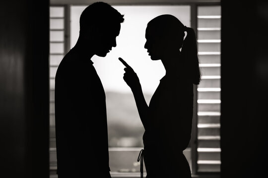 Young wife woman nagging her husband. Bad relationship, jealousy, frustration concept.  