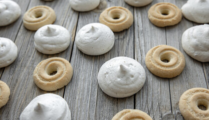 Freshly baked gingerbread cookies and bizet on a wooden table close-up.