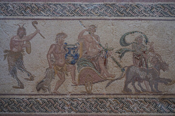 Mosaic art of Pafos Archaeological Park. The triumphal procession of Dionysus. The god of wine and ritual madness sits on a chariot drawn by panthers. Paphos, Cyprus.