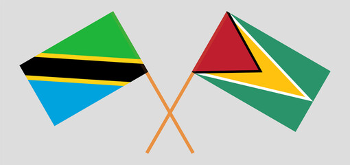 Crossed flags of Tanzania and Guyana. Official colors. Correct proportion