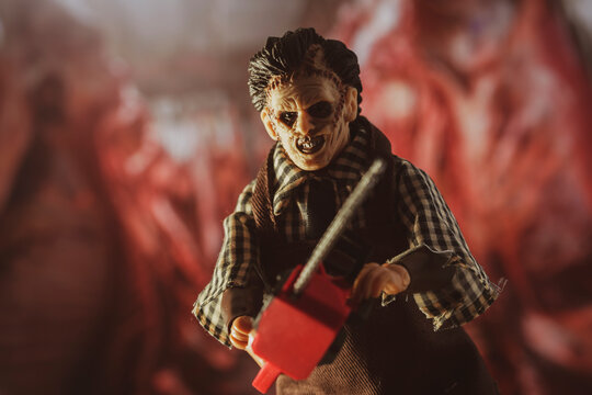 NEW YORK USA, JUNE 23 2021: Scene from Texas Chainsaw Massacre, killer Leatherface hunts victims with his chainsaw  - Mego Corp action figure