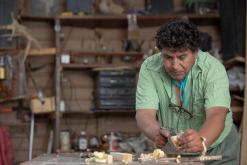 Mexican carpenter working in his workshop