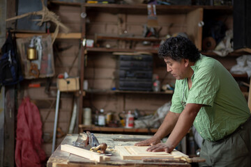 Mexican carpenter working in his workshop