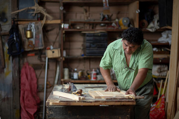 Mexican carpenter working in his workshop
