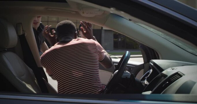 Police officers arresting African American driver