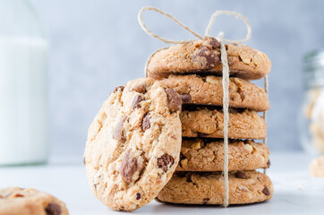Chocolate chip cookies with milk on marble