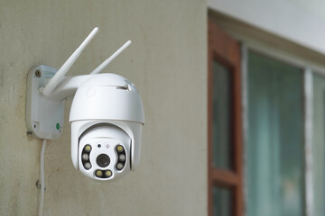 Professional technician installing CCTV cameras or surveillance systems in buildings, offices,...