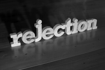 Rejection, text words typography written with wooden letter on black background, life and business...