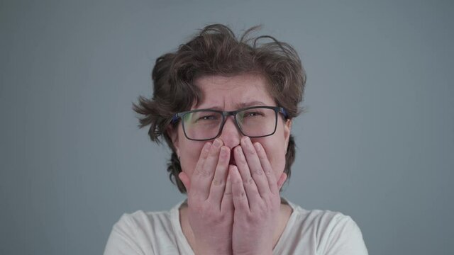 Broken central incisor tooth. Human teeth and dentures concept. Female with facial injuries after violence. Abuse and agression. Tooth broken half off. Beaten woman victim of domestic outrage.