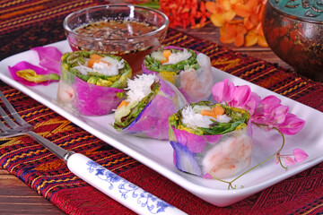 Spring rolls : Edible flowers spring rolls. Beautiful and delicious Thai cuisine. Colorful appetizer made from edible flowers, shrimps, rice noodle and organic vegetables wrapped with rice paper
