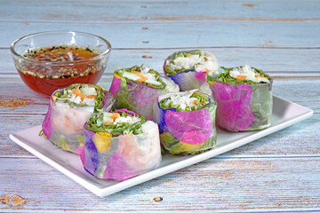 Spring rolls : Edible flowers spring rolls. Beautiful and delicious Thai cuisine. Colorful appetizer made from edible flowers, shrimps, rice noodle and organic vegetables wrapped with rice paper