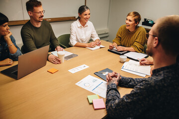 Business professionals in meeting room