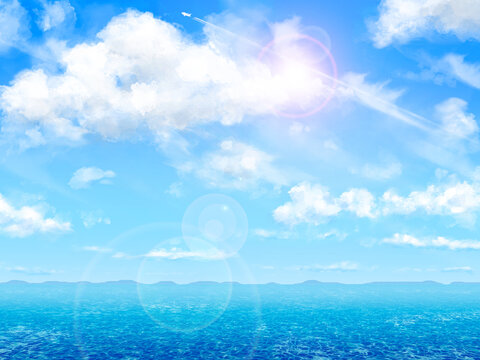 夏の海と飛行機雲のある青空