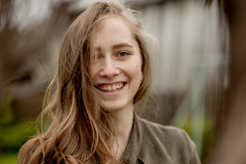 Portrait of young beautiful girl in outdoors