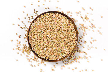Pile of raw buckwheat isolated on white background.
