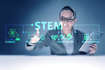 Businesswoman pressing virtual buttons in STEP education concept