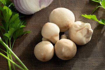 Cooking edible puffball mushrooms. Several whole mushrooms on a cutting board