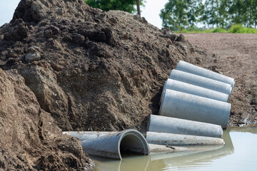Concrete Drainage Pipe on a Construction Site, Concrete drainage pipes stacked for construction.