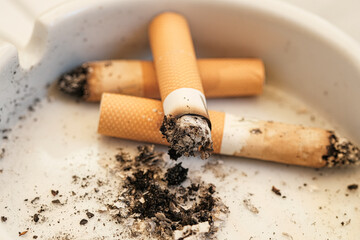 Burning Cigarette butts,tobacco waste,smoke addiction,unhealthy lifestile