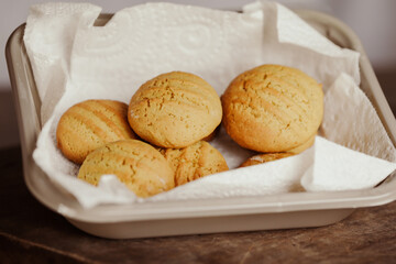 Stack of homemade cookies on wooden board. Baking in country kitchen.