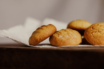 Stack of homemade cookies on wooden board. Baking in country kitchen.