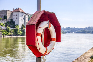 A safety buoy beneath a landing place at a river