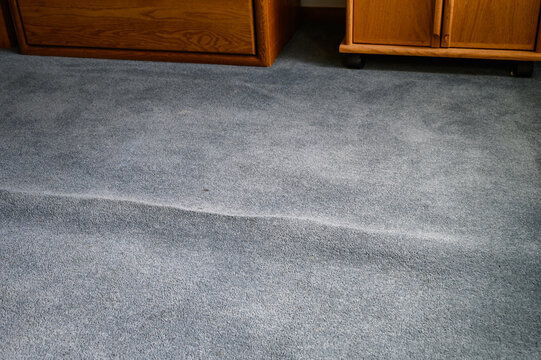 Old, Stained, And Wrinkled Blue Carpet Poses A Tripping Hazard, Home Interior
