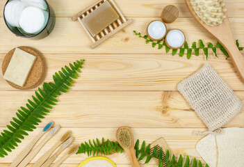 Fototapeta na wymiar Natural cleaning bamboo, coconut dish brushes on wooden table. Eco friendly with No plastic kitchen and home cleaning. Top view, flat lay. Sustainable lifestyle, Zero waste concept.