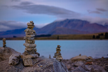 Fototapeta na wymiar Stacks of rocks on the shore of Lake Tekapo