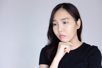 unhappy and worried young asian woman