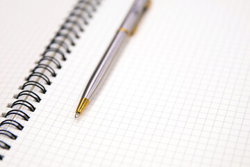 Close-up notebook or note book diary with a pen or pencil on top view desk or boardroom table for meeting notes.