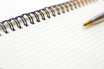 Close-up notebook or note book diary with a pen or pencil on top view desk or boardroom table for meeting notes.