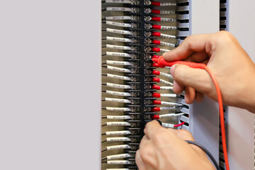 Electricity and electrical maintenance service, Engineer use meter checking electric current...